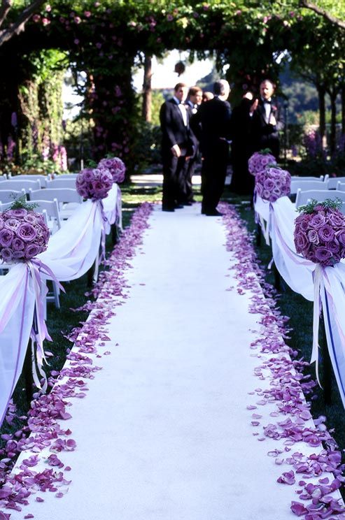 Wedding - Fresh Roses In Soft Tones Of White And Pink, Contrasted With Dark Greens, Make A Lovely, Traditional Centerpiece.