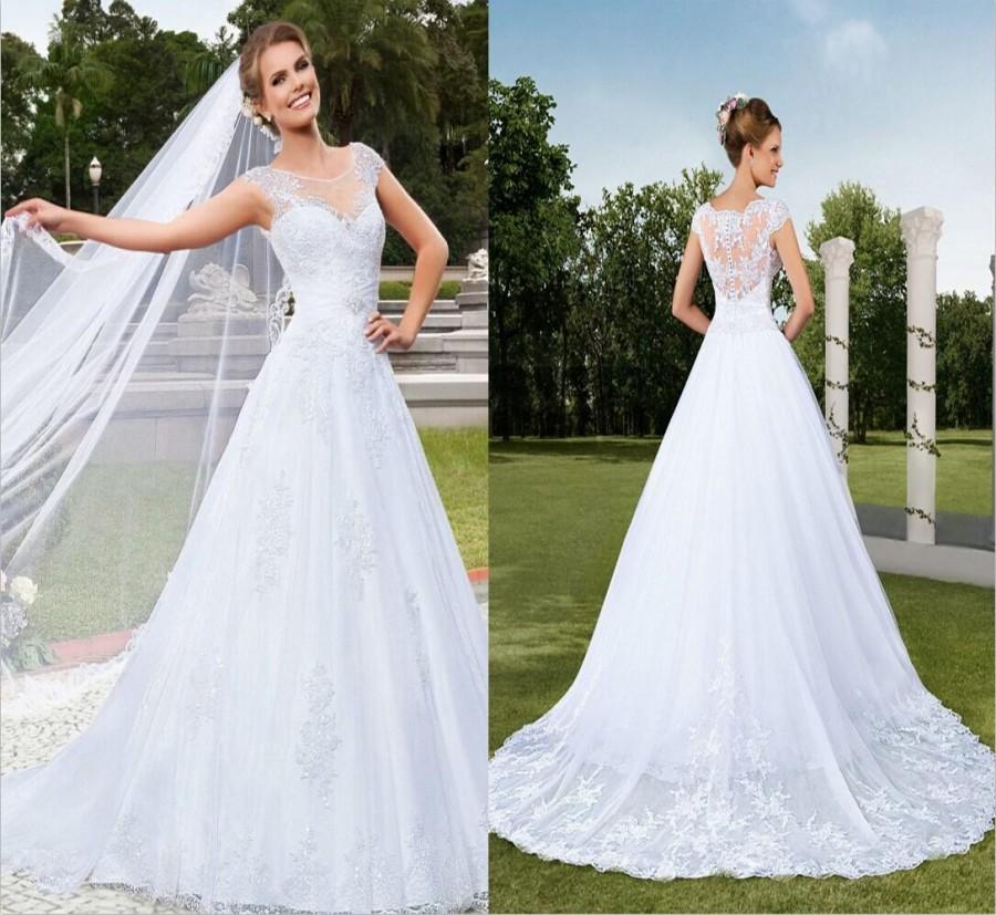 Mariage - 2015 New Arrival Vestidos De Noiva Sexy Illusion Neck A-Line Wedding Dresses Beaded Vintage Applique Tulle Button Garden Bridal Gowns Online with $112.82/Piece on Hjklp88's Store 