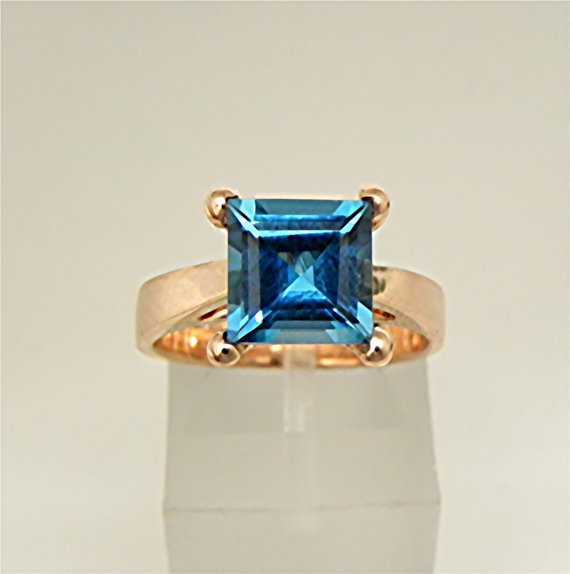 Mariage - AAA London Blue Topaz 8x8mm Step cut set in a 14K Rose gold cathedral style engagement ring.  1937