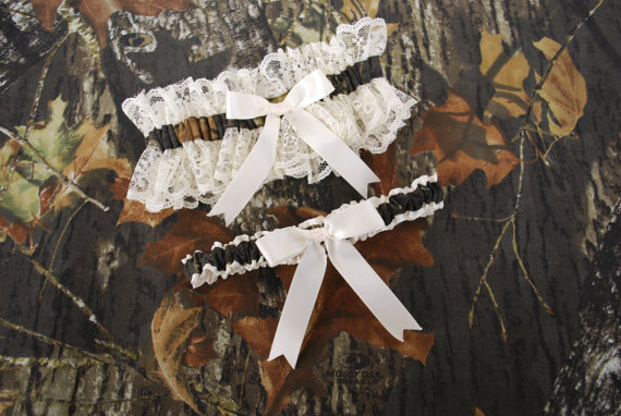Свадьба - Wedding Garter Set - Ivory Satin Ribbon and Lace with Mossy Oak Camo Break Up Trim and a Double Heart Charm