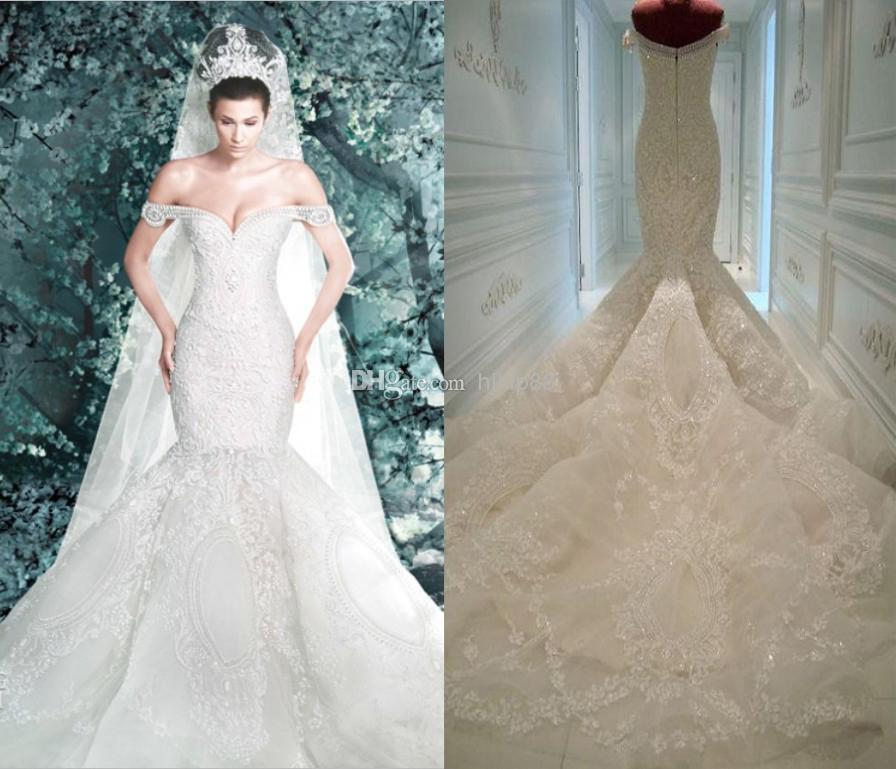 Hochzeit - Michael Cinco Wedding Dresses 2014 New Arrival Pearls Lace Appliques Off Shoulder Sheer Backless Luxury Mermaid Wedding Dress Bridal Gowns, $254.11 