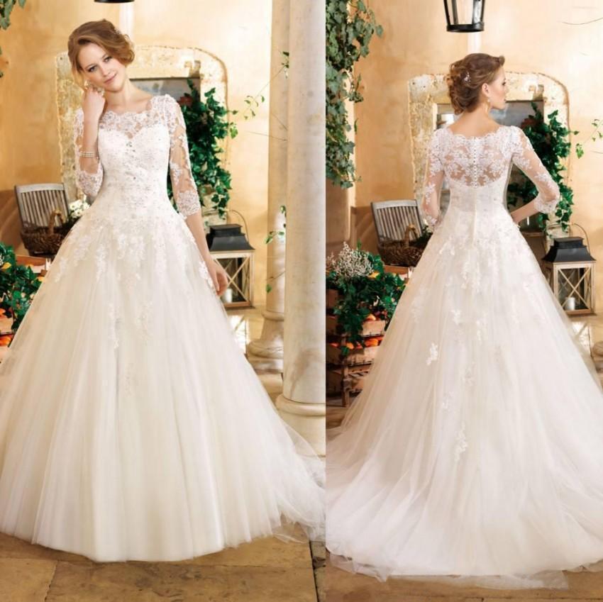 Mariage - 2016 Vintage Church Wedding Dresses 3/4 Long Sleeve Miss Kelly High Neck Covered Button Wedding Dresses With Lace Crystal Sheer Bridal Gowns Online with $116.24/Piece on Hjklp88's Store 
