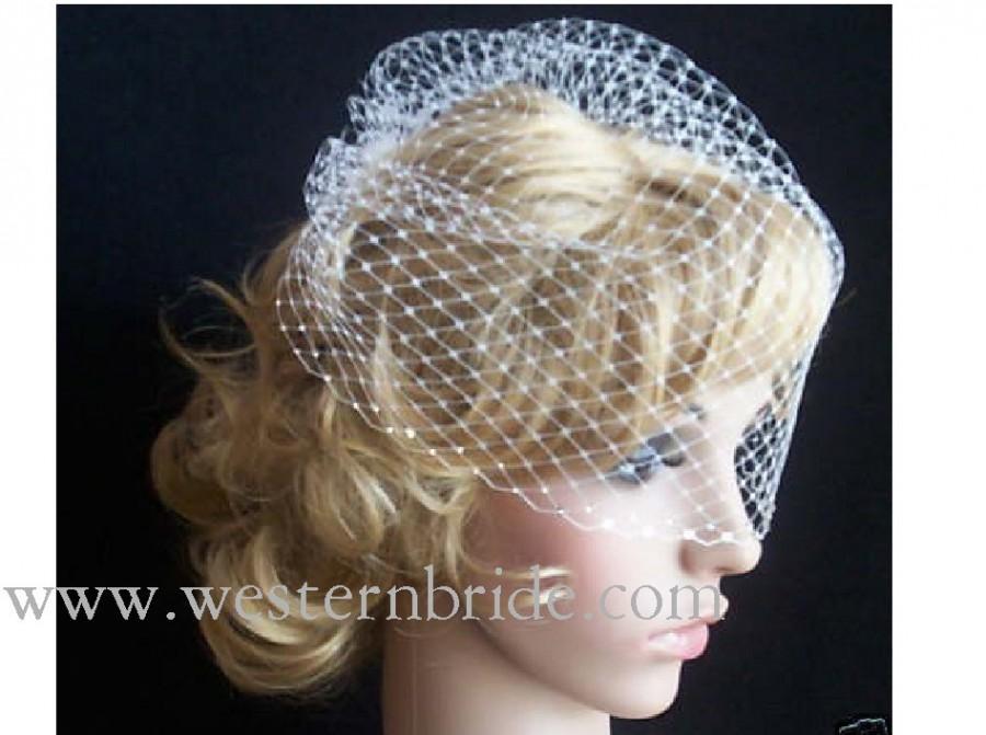 Wedding - Ivory birdcage veil 12" goes til the pick of the nose. with swarovski crystals on the edge.