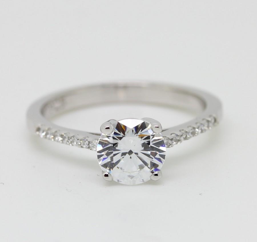 white sapphire solitaire ring