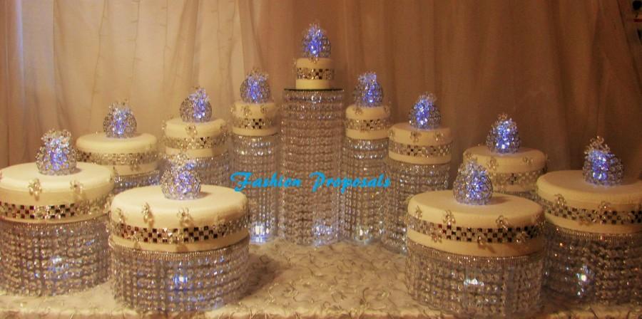 Hochzeit - Wedding Cake Stand Cascade waterfall crystal set of 11 wedding acrylic cake stands with a battery operated LED light.