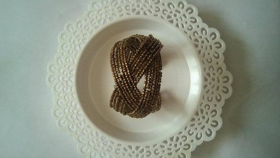 Hochzeit - Flexible Bracelet with Gold Color Beads...