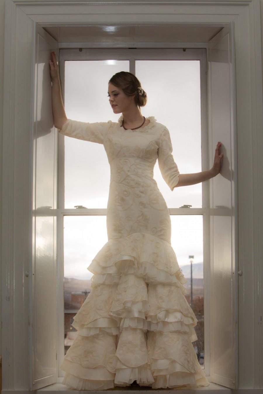 زفاف - Ivory Wedding Dress with an asymmetrical sweetheart neckline, half sleeves and fit-and-flare multilayered skirting. Made to order