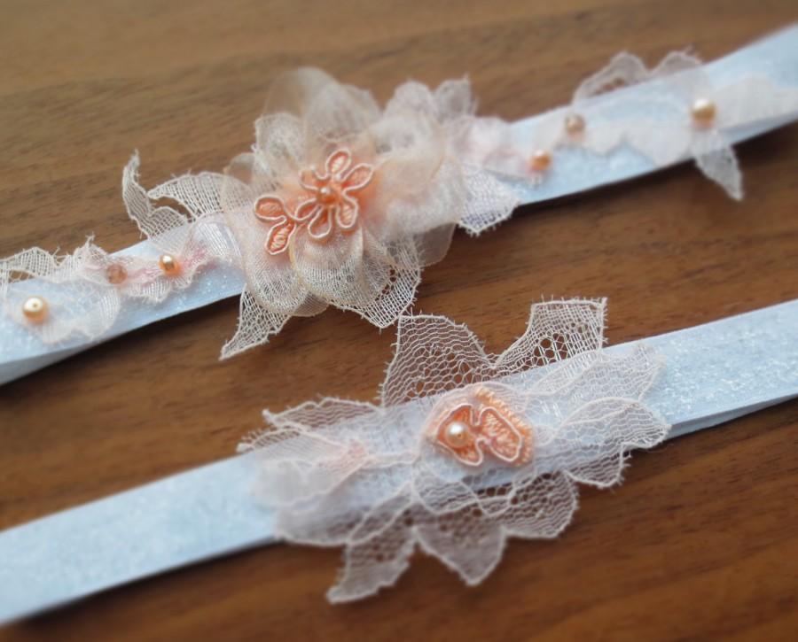 Hochzeit - Whimsical White and Peach Wedding Garter set- Bridal keepsake, toss away garter w/ peach pink lace floral appliques, crystals and pearls