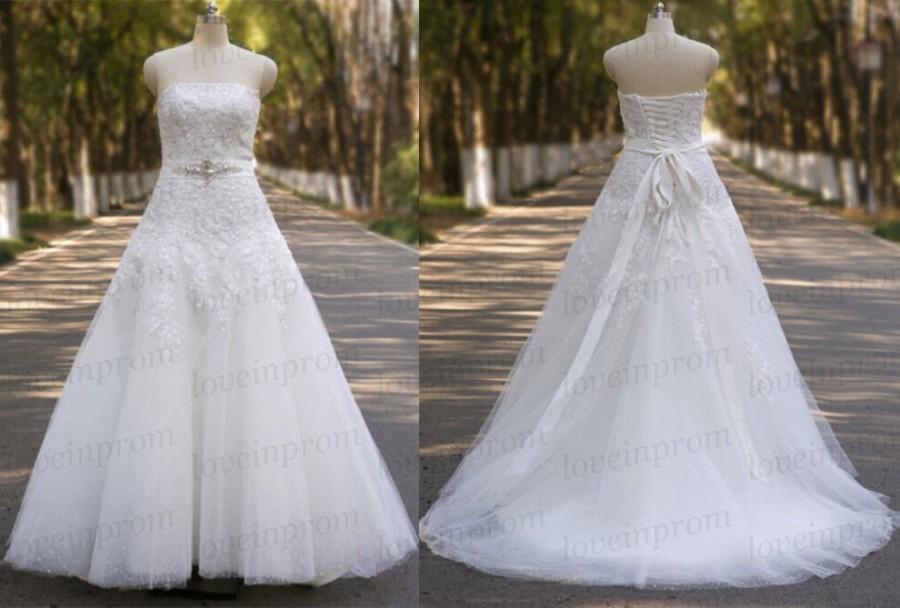 Mariage - 100% Handmade Beading Tulle A-line Wedding Dress Strapless White Iovry Sweep Train Lace Up Bridal Gowns
