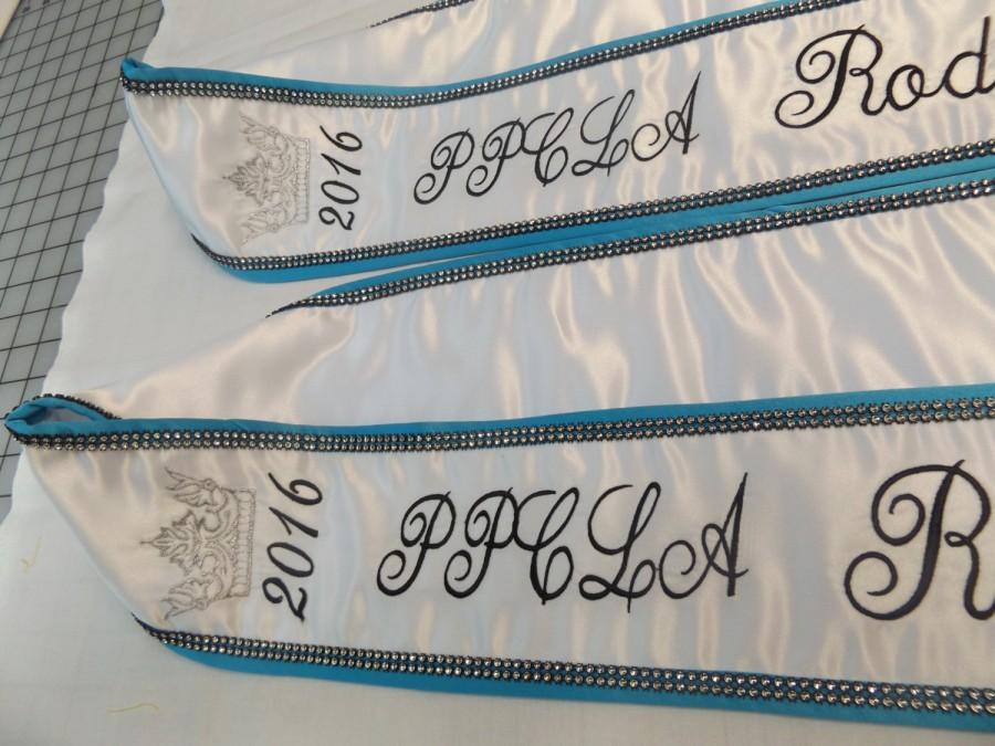 Hochzeit - Pageant sashes in White satin / turquoise trim/ white fringe / silver black bling front and back/ Design your sashes your way