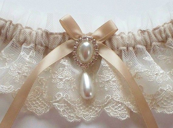 Свадьба - Lace Garter, Wedding Garter In Ivory Lace On Champagne Band With Pearl And Crystal Detail - The MEREDITH Garter