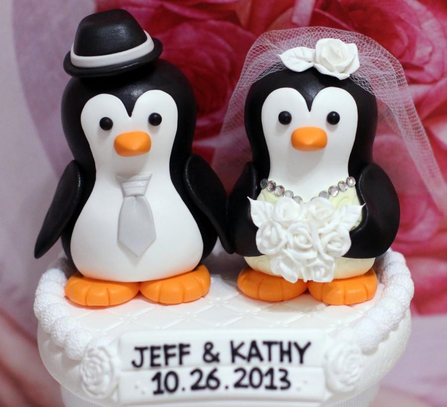 Hochzeit - A penguin couple wedding cake topper. / white roses