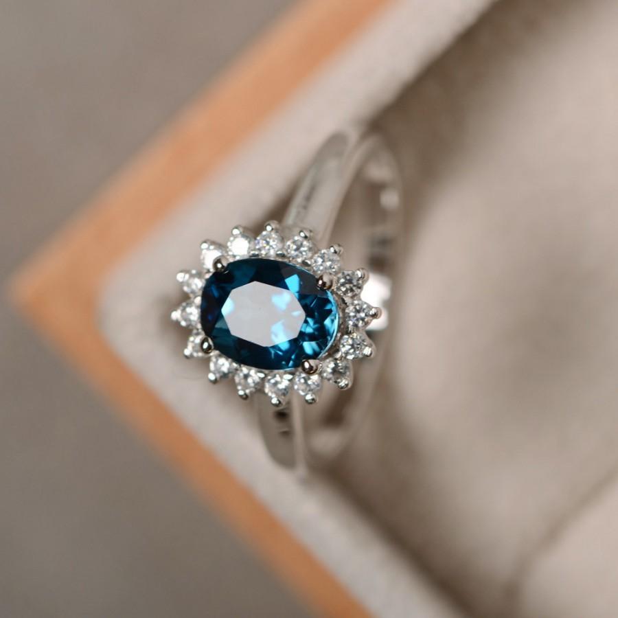 925 sterling silver blue topaz ring with two diamonds