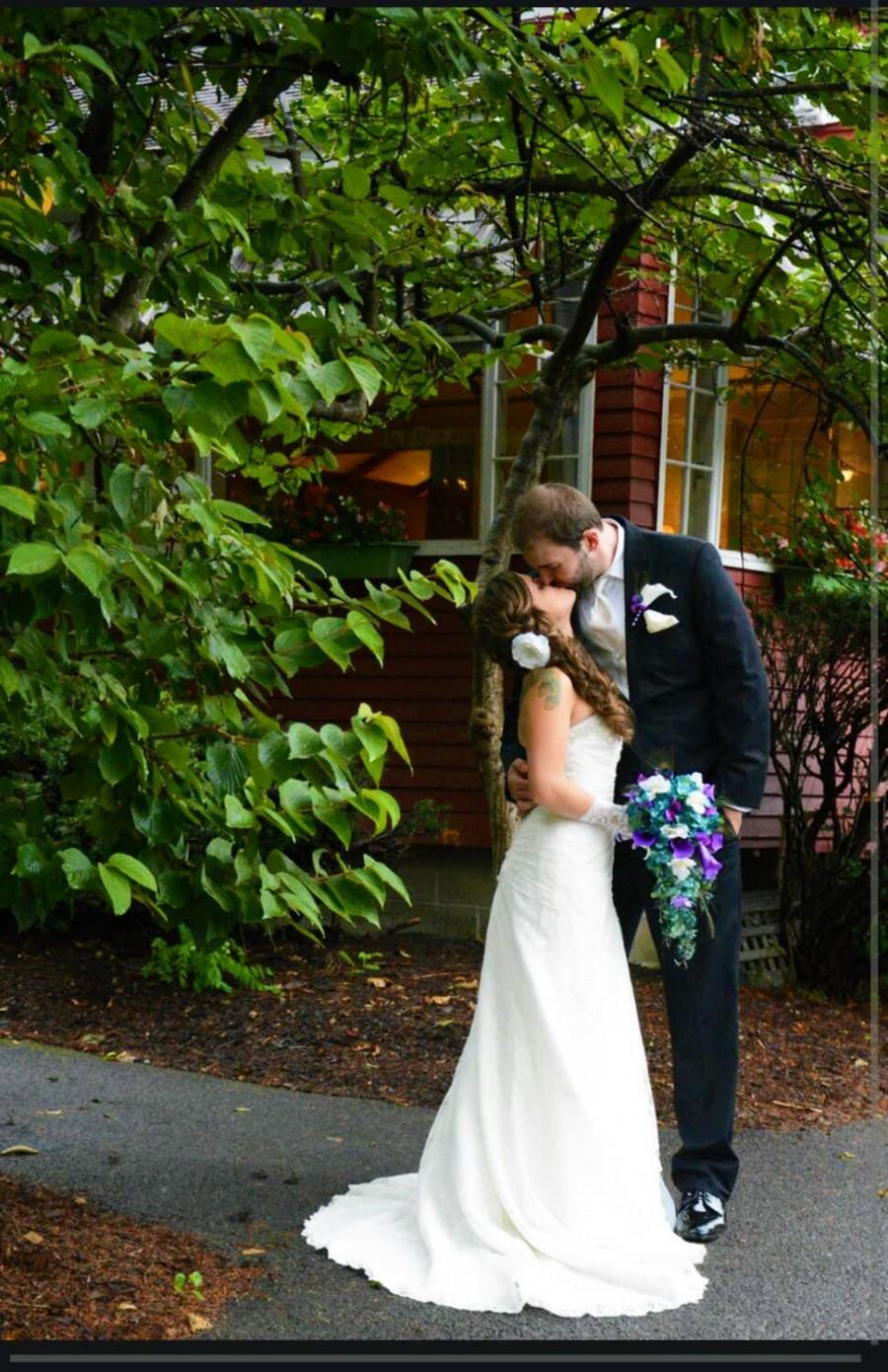 Wedding - Cascading bridal bouquet with teal hydrangeas, purple calla lilies and white orchids, peacock feather accent