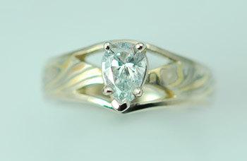Hochzeit - Custom hand crafted Tri color Wedding Mokume Gane wedding ring with pear shaped diamond