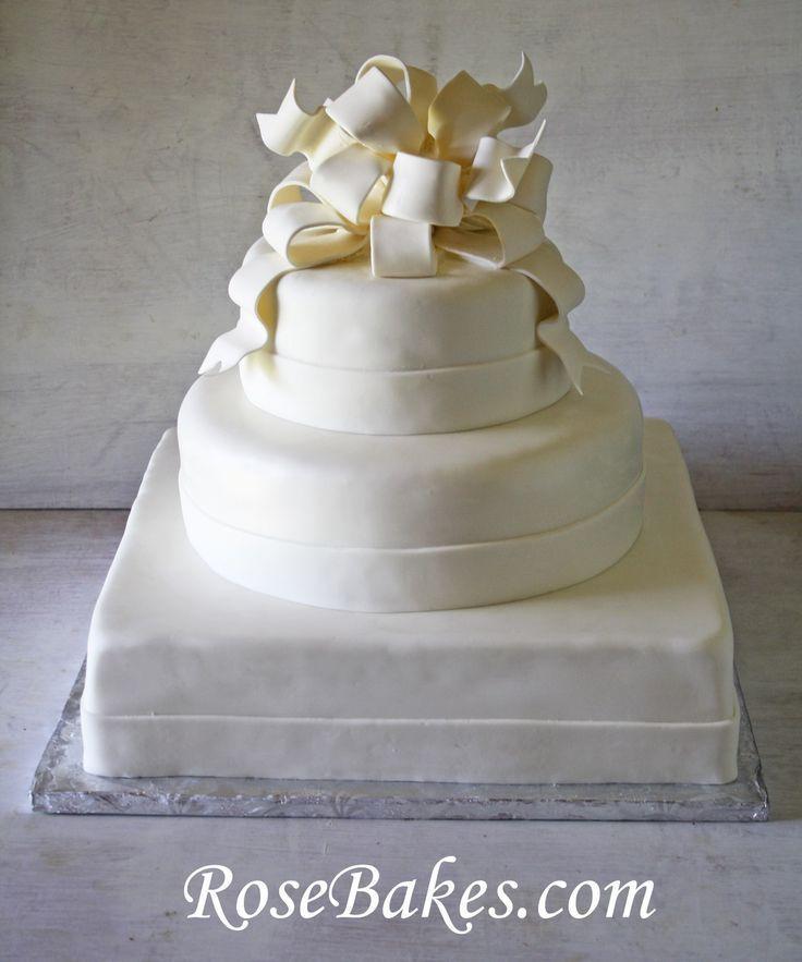 زفاف - Elegant White Wedding Cake With Poofy Gum Paste Bow