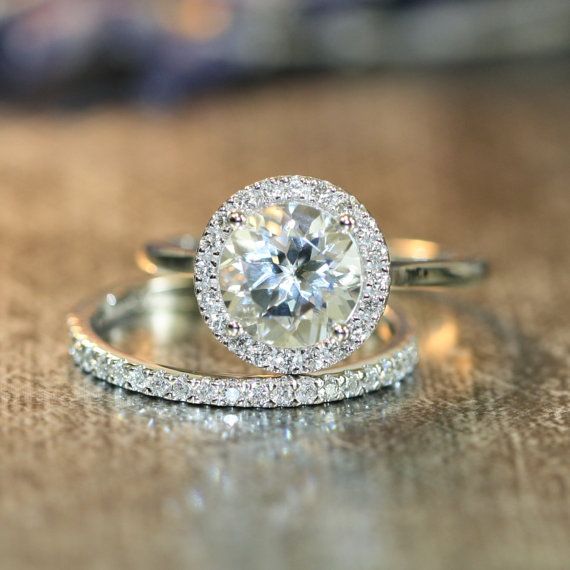 زفاف - This Halo Diamond Wedding Ring Set Showcases A Halo Engagement Ring With A 8x8mm Round Shaped Natural White Topaz Cr… 
