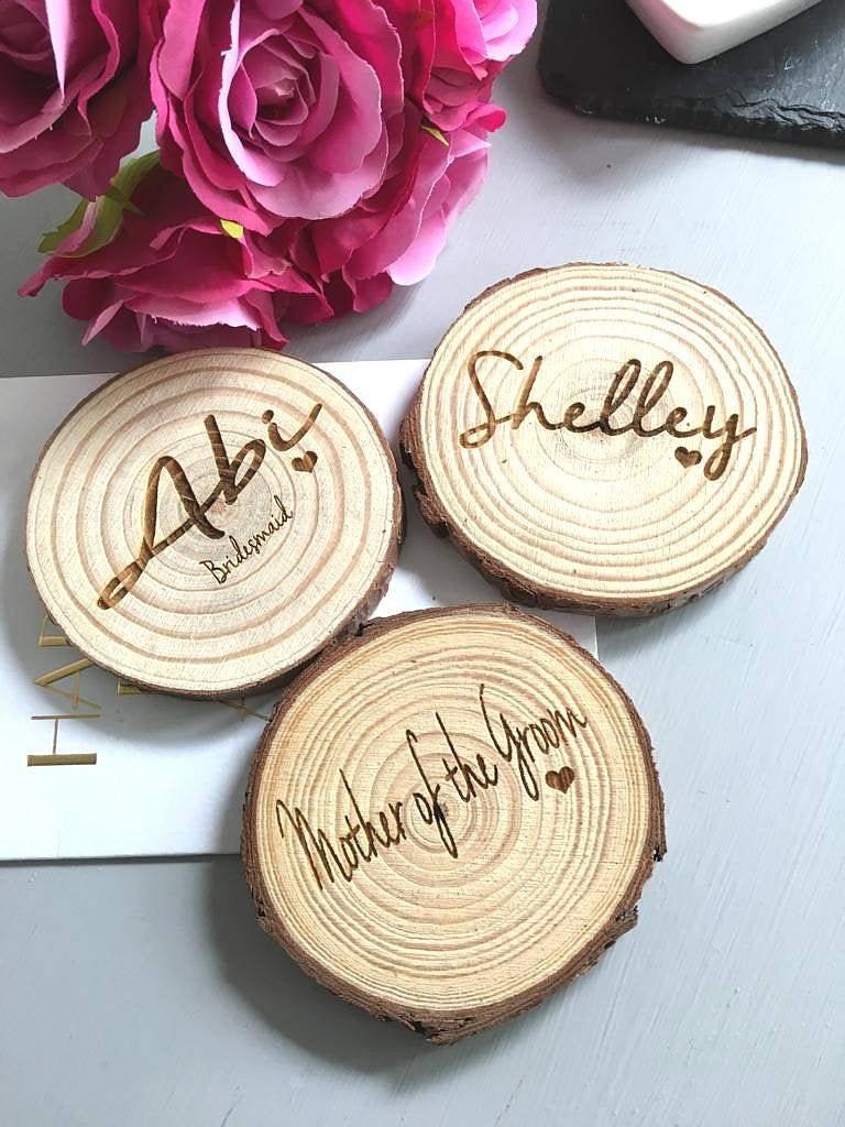 rustic engraved wooden name places log slices wedding table decor name places 