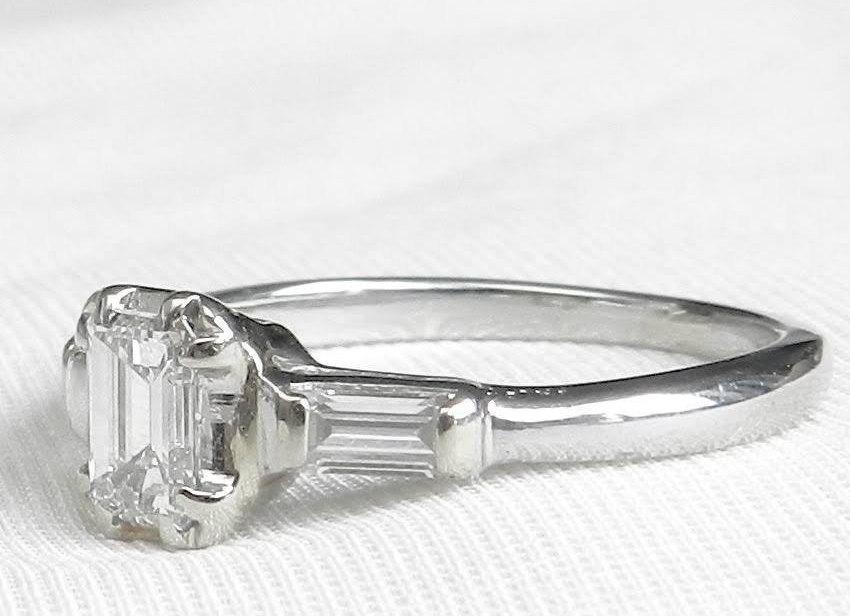 Hochzeit - Art Deco Engagement Ring .86 ct Tdw Platinum Emerald Cut Diamond VVSI Colorless
