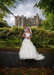 wedding photo - Bride and groom in front of Arundel Castle