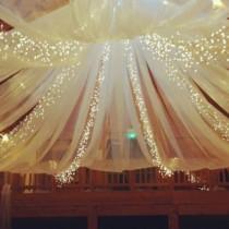 wedding photo - Tulle And String Lights In The Barn. 