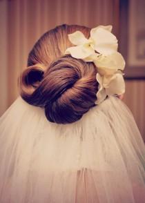 wedding photo - Infinity knot wedding hairstyle for the bride