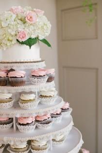 wedding photo - White wedding cake and cupcake decorated with pink roses