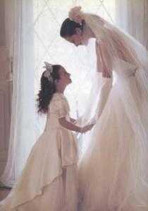 wedding photo - Cute Bride And Flower Girl Pose. 