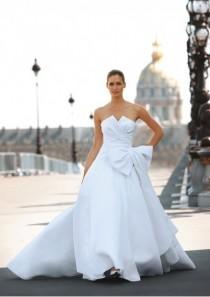 wedding photo -  Organza Strapless Notched Neckline Pleated Bodice With Bow Accents A-line Skirt With Attached Chapel Train Hot Sell Wedding Dres