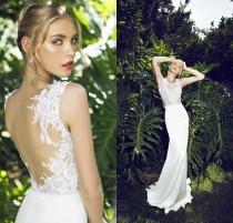 wedding photo - 2015 Lace Spring Wedding Dresses Sleeveless Jewel Neck Sheer Beach Garden Sweep Train Mermaid Bridal Gown Fishtail Backless Bridal Dresses Online with $109.66/Piece on Hjklp88's Store 
