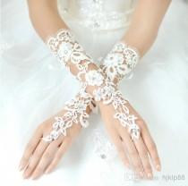 wedding photo - New Beautiful Bridal Accessories About 29cm Luxury Lace Flower Glove Hollow Long Bridal Gloves Wedding Dresses Accessories White And Ivory Online with $10.51/Pair on Hjklp88's Store 