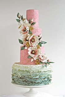 wedding photo - A Four-Tiered Cake With Cascading Flowers