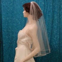 wedding photo - Cascading Cut Bridal veil trimmed with a Satin Rattail Cord