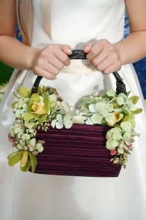 wedding photo - Green Cymbidium Orchids And Hydrangeas Decorate This Purple Flower Girl Basket, Full Of Light Hydrangea Petals.