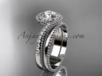 wedding photo -  platinum halo diamond engagement set with a "Forever One" Moissanite center stone ADLR379S