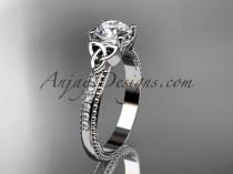 wedding photo -  platinum diamond celtic trinity knot wedding ring, engagement ring with a "Forever One" Moissanite center stone CT7391