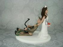 wedding photo - Nurse Dragging Hunter Personalized Wedding Cake Topper
