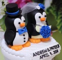 wedding photo - A penguin couple wedding cake topper. / blue roses