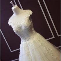 wedding photo - JW16198 Beautiful sheer tulle top open back princess bridal dress