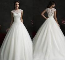 wedding photo - Glamorous Amelia Sposa 2016 Spring Collection Sheer Top Lace A Line Wedding Dresses Appliques Beads Backless Bridal Gown Cap Sleeves BO9609 Online with $114.66/Piece on Hjklp88's Store 