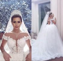 wedding photo -  Gorgeous Wedding Dresses Lace Applique 2016 Off Shoulder Tulle Beads Hollow White Bridal Ball Gowns Chapel Train Capped Vestido De Noiva Online with $110.81/Piece o