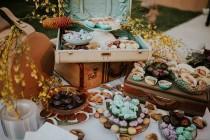 wedding photo - Use vintage suitcases to display your reception treats