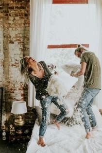 wedding photo - This Couple's Pillow Fight Photo Shoot Is Fun, Flirty, And Full Of Feathers