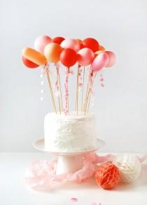 wedding photo - Craft Tutorial: DIY Tassel Balloon Cake Topper
