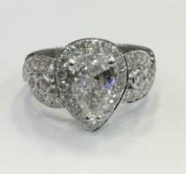 wedding photo - Pear shape halo engagement ring