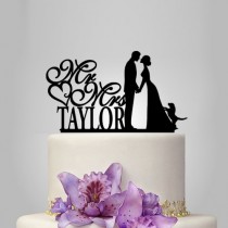 wedding photo -  Bride and groom wedding cake topper with dog mr and mrs monogram