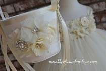 wedding photo -  Ivory flower girl basket and ivory pillow