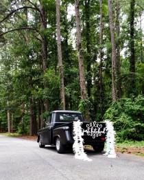 wedding photo - just hitched or just married sign - getaway car
