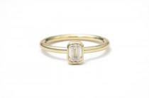 wedding photo - Emerald cut diamond 18k yellow gold engagement ring. Step cut either asscher cut or emerald. Simple bezel ring with milgrain detail